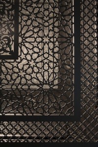Image:  Anila Quayyum Agha, Intersections (detail), 2013 6.5’ cube, laser-cut wood, black Lacquer, light bulb, cast shadows  46'x46’x16’ Photo: Michael Hoefle